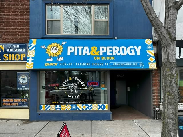 Refaced storefront awning with new window vinyl on Bloor St