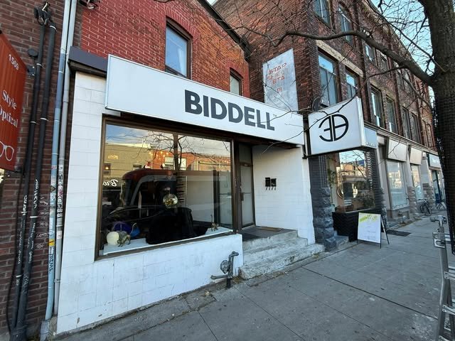 Storefront and blade sign for Biddell