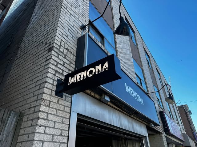Custom blade sign and refaced fascia sign installed at a lodge/bar
