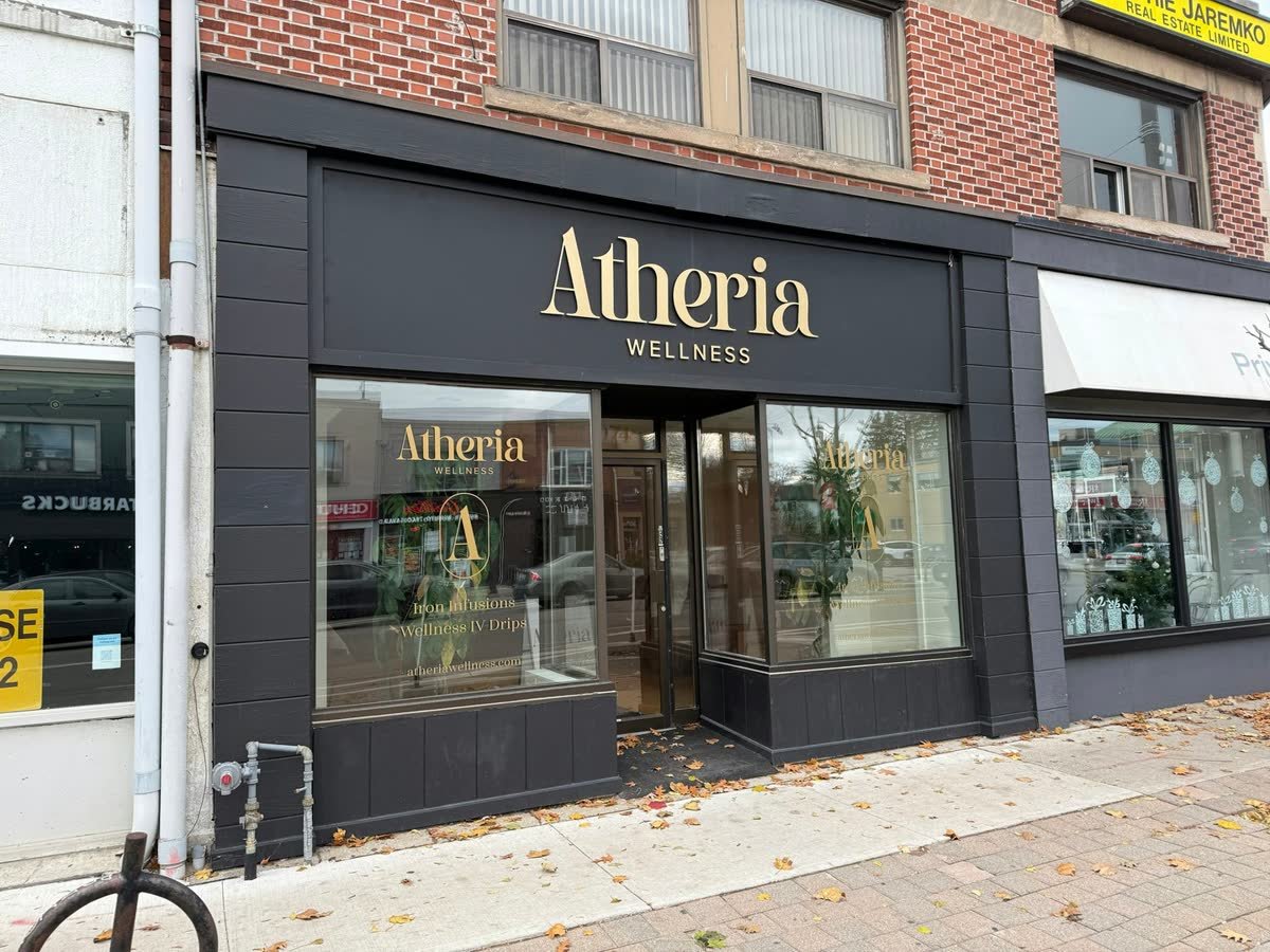 Storefront with custom exterior lettering and window vinyl for a wellness clinic