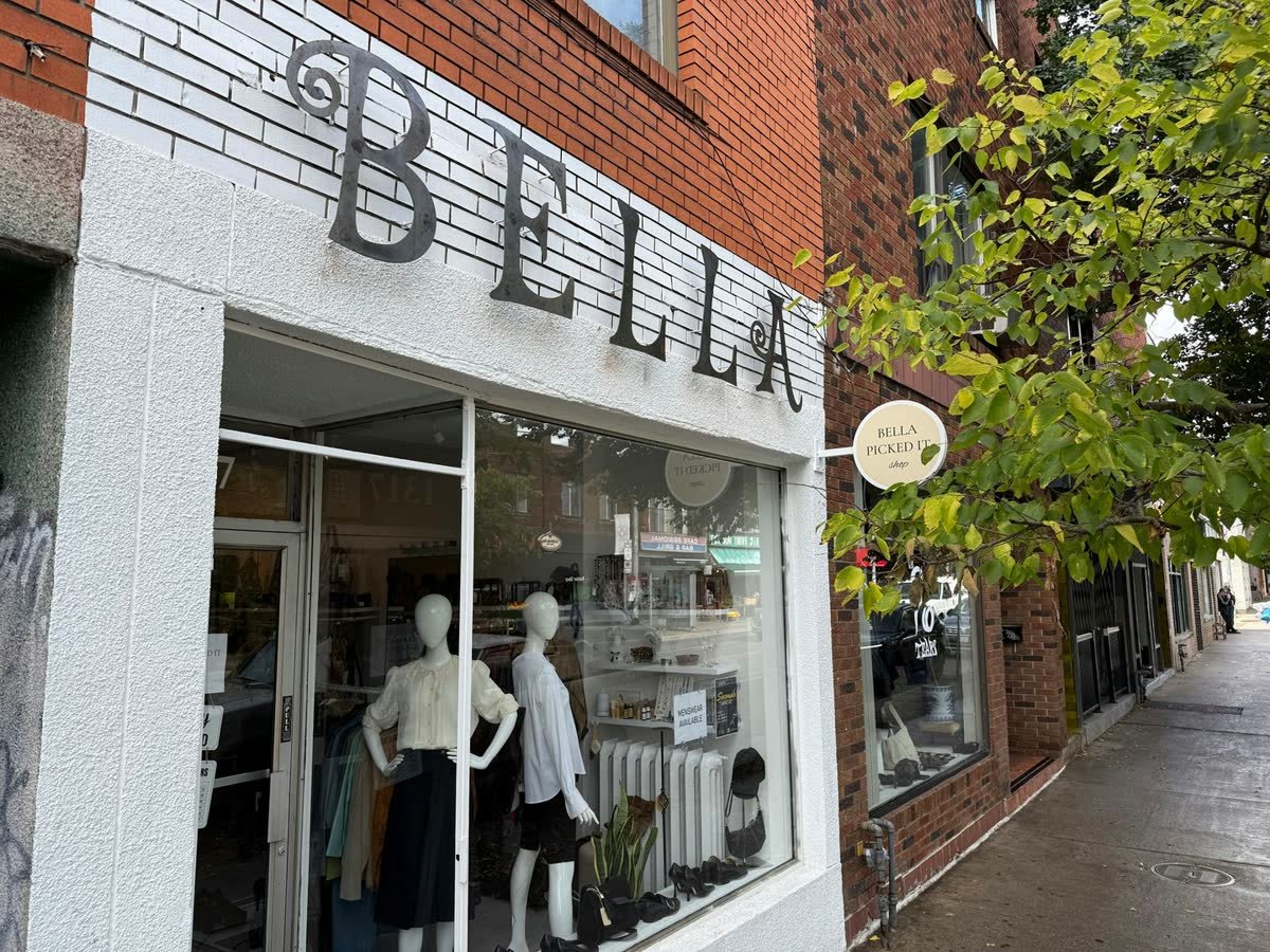 Custom steel letters and fabricated blade sign on a shop facade